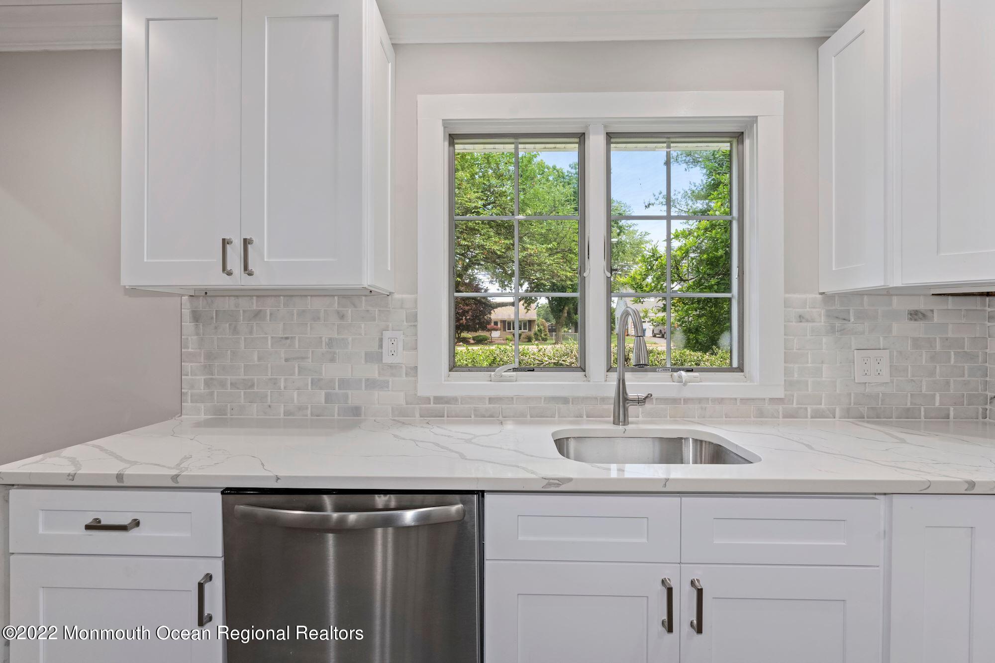 738 Holmdel Road Holmdel, NJ 07733 - Photo 17 of 36 a kitchen with a sink and cabinets
