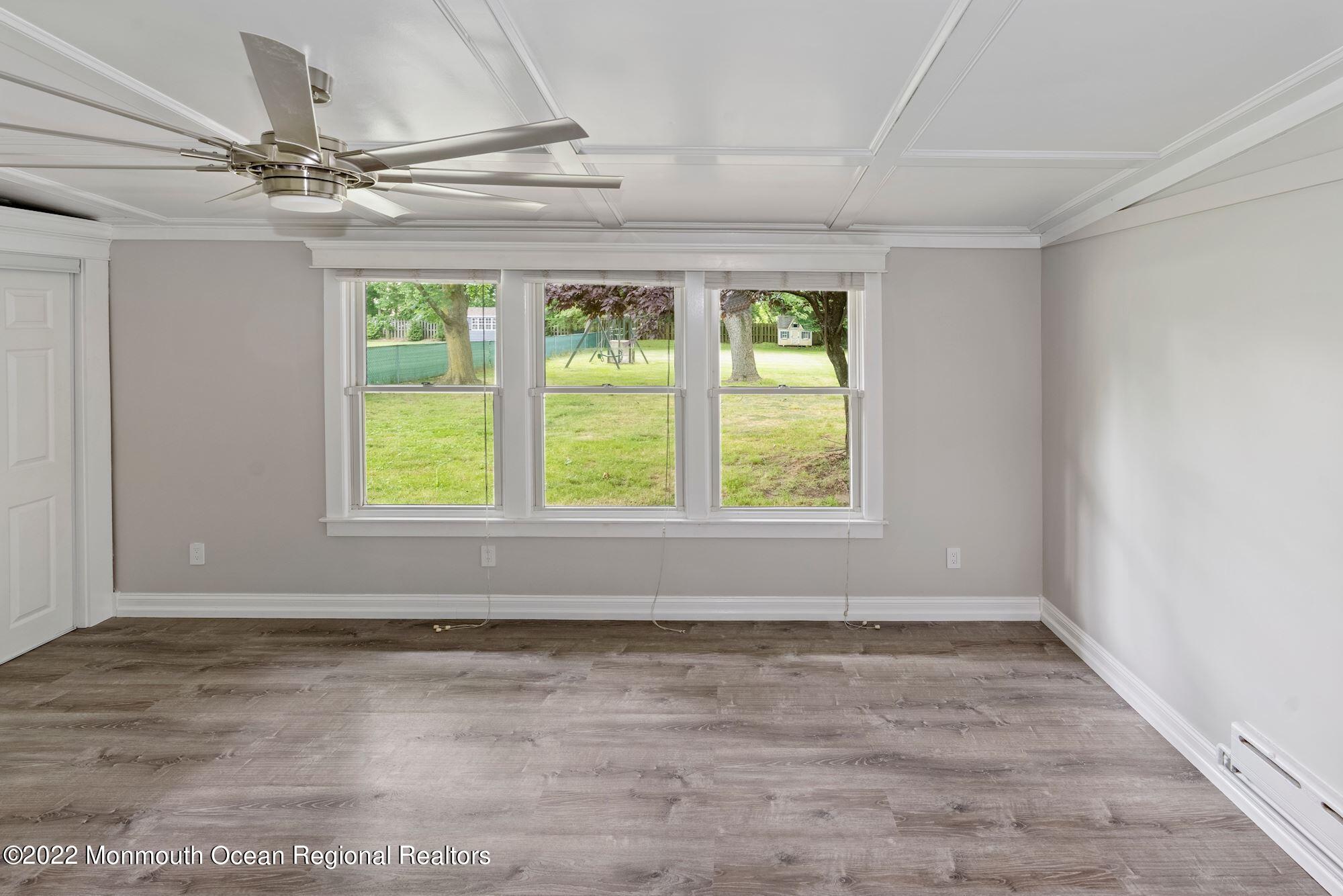 738 Holmdel Road Holmdel, NJ 07733 - Photo 20 of 36 a view of a livingroom with a ceiling fan and window