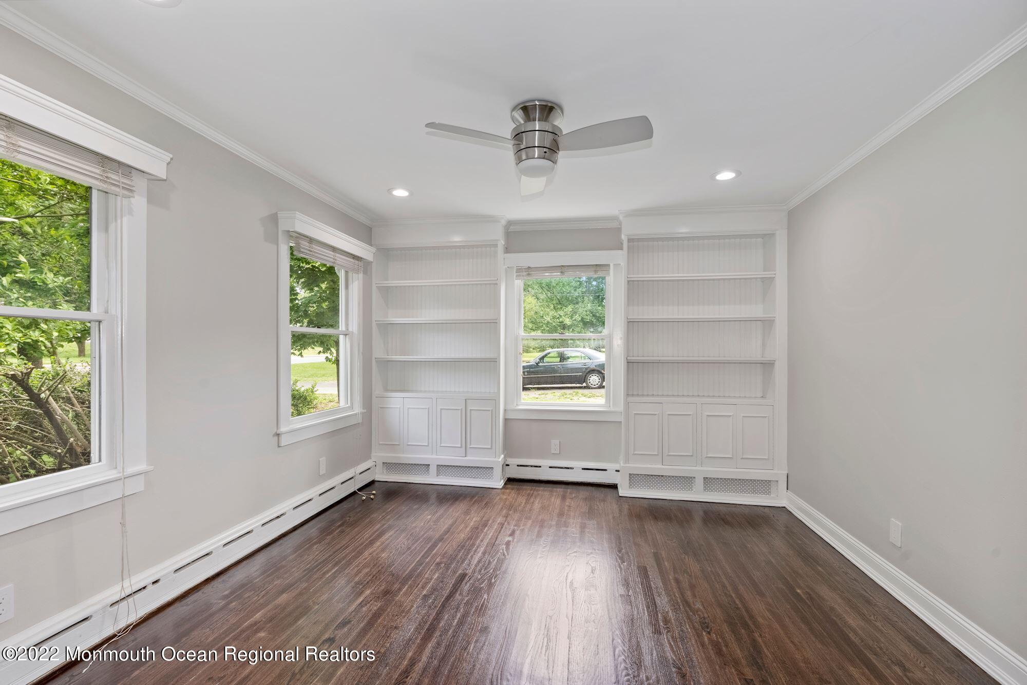 738 Holmdel Road Holmdel, NJ 07733 - Photo 24 of 36 wooden floor in an empty room with a window