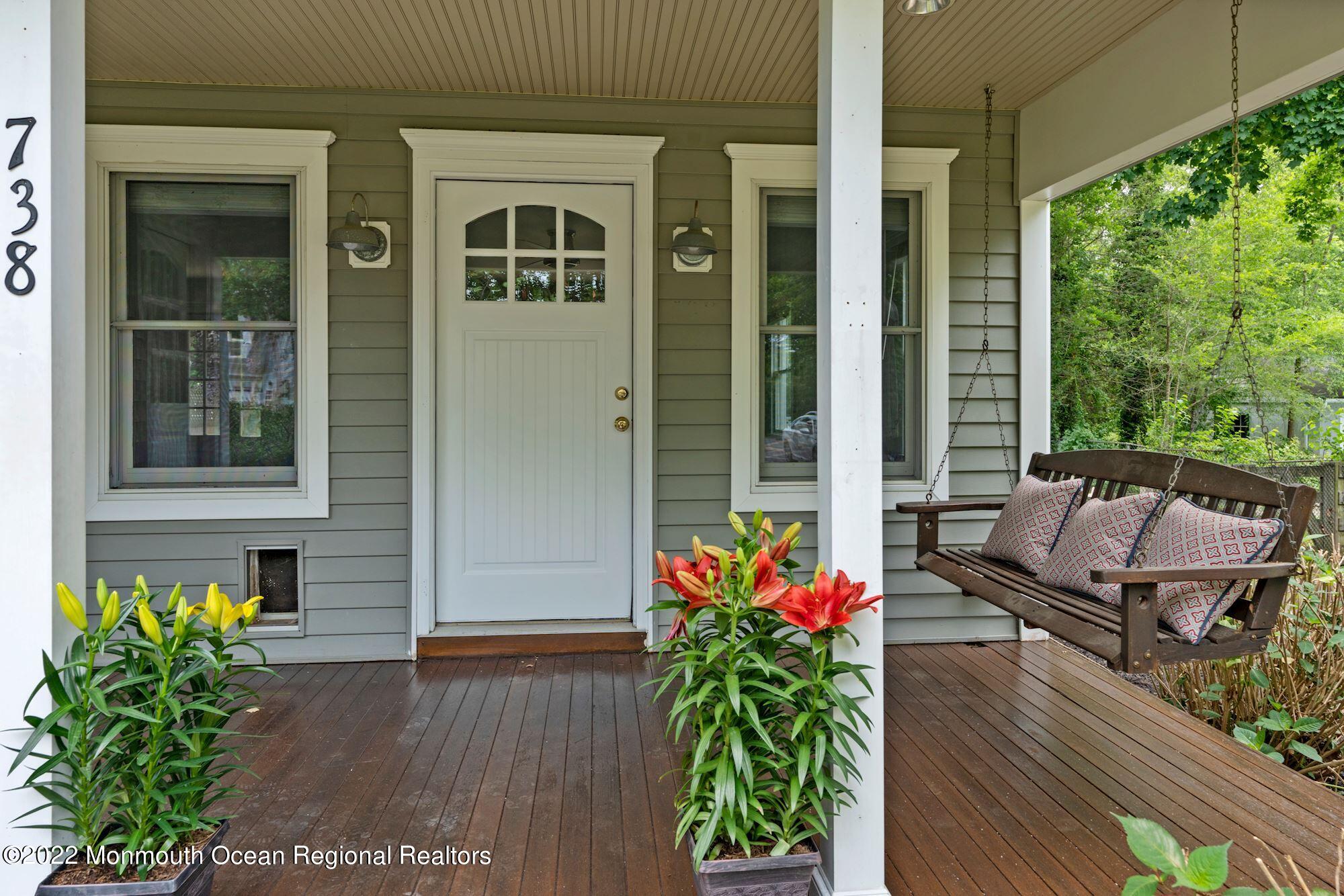 738 Holmdel Road Holmdel, NJ 07733 - Photo 25 of 36 a front view of a house with a porch
