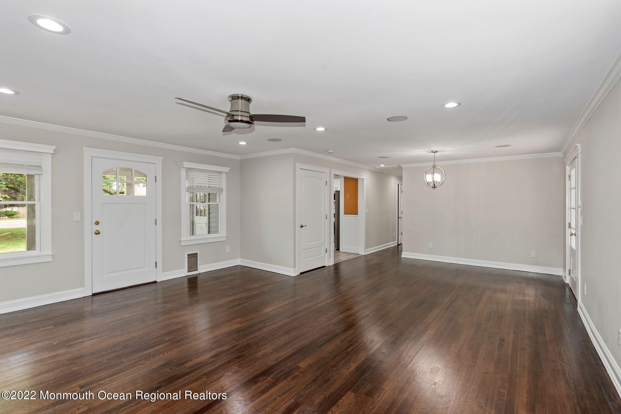 738 Holmdel Road Holmdel, NJ 07733 - Photo 30 of 36 an empty room with wooden floor and windows