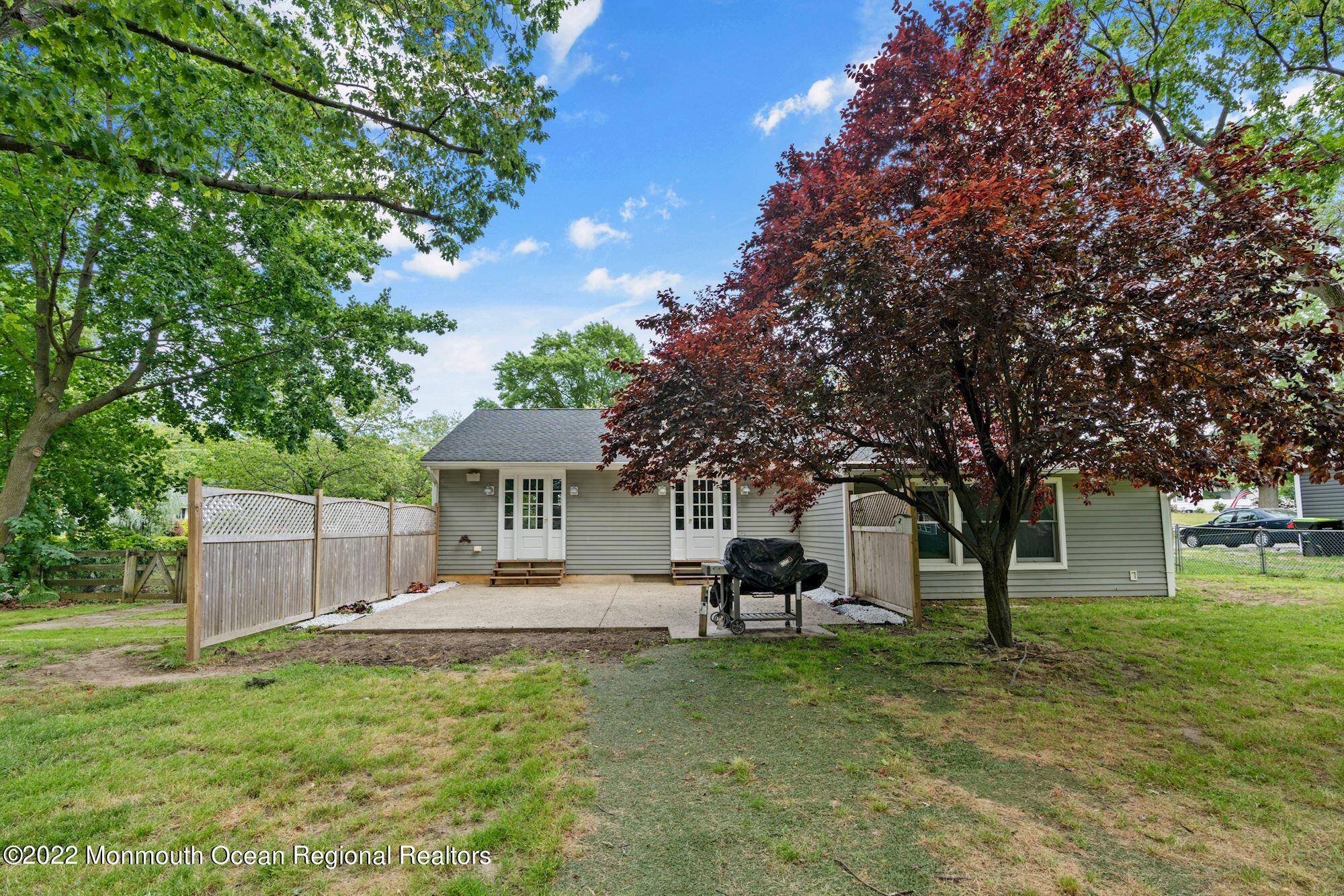 738 Holmdel Road Holmdel, NJ 07733 - Photo 36 of 36 a front view of a house with a yard