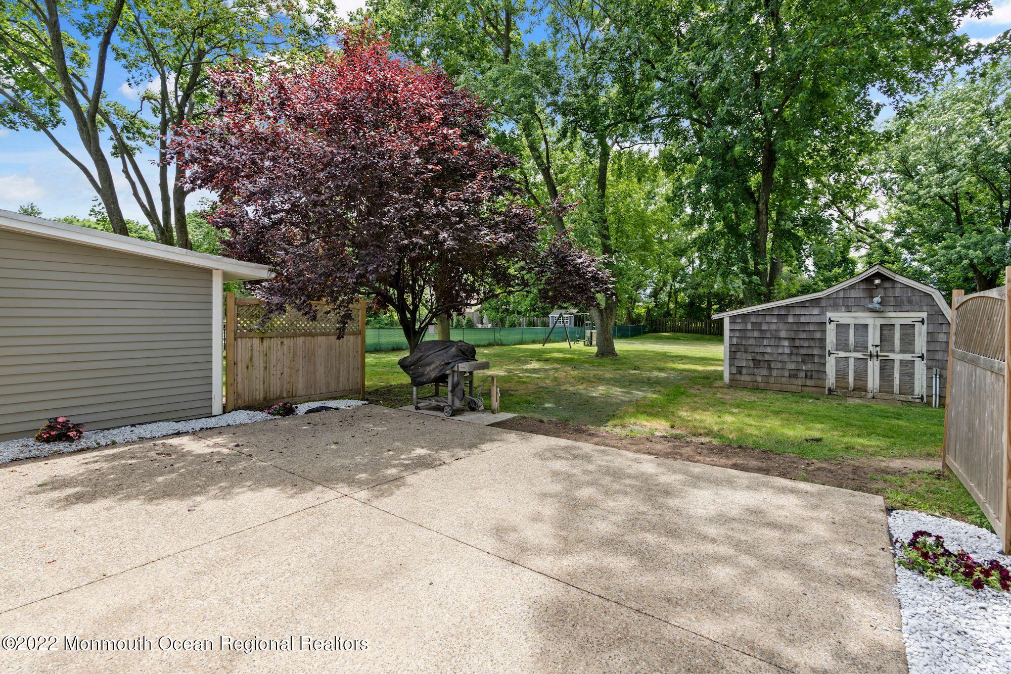 738 Holmdel Road Holmdel, NJ 07733 - Photo 7 of 36 a view of a house with backyard and trees
