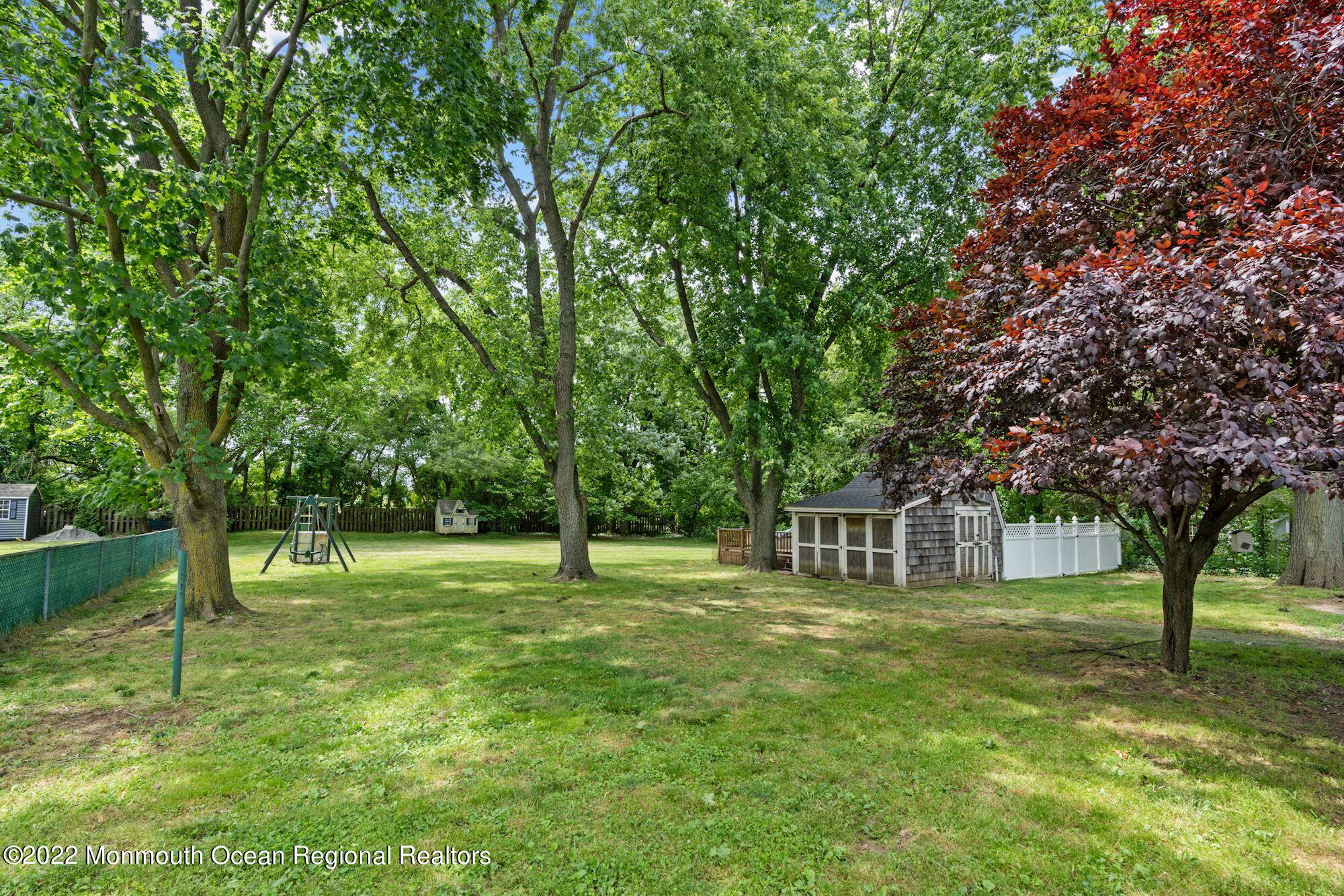 738 Holmdel Road Holmdel, NJ 07733 - Photo 8 of 36 a house view with a play ground in front of it