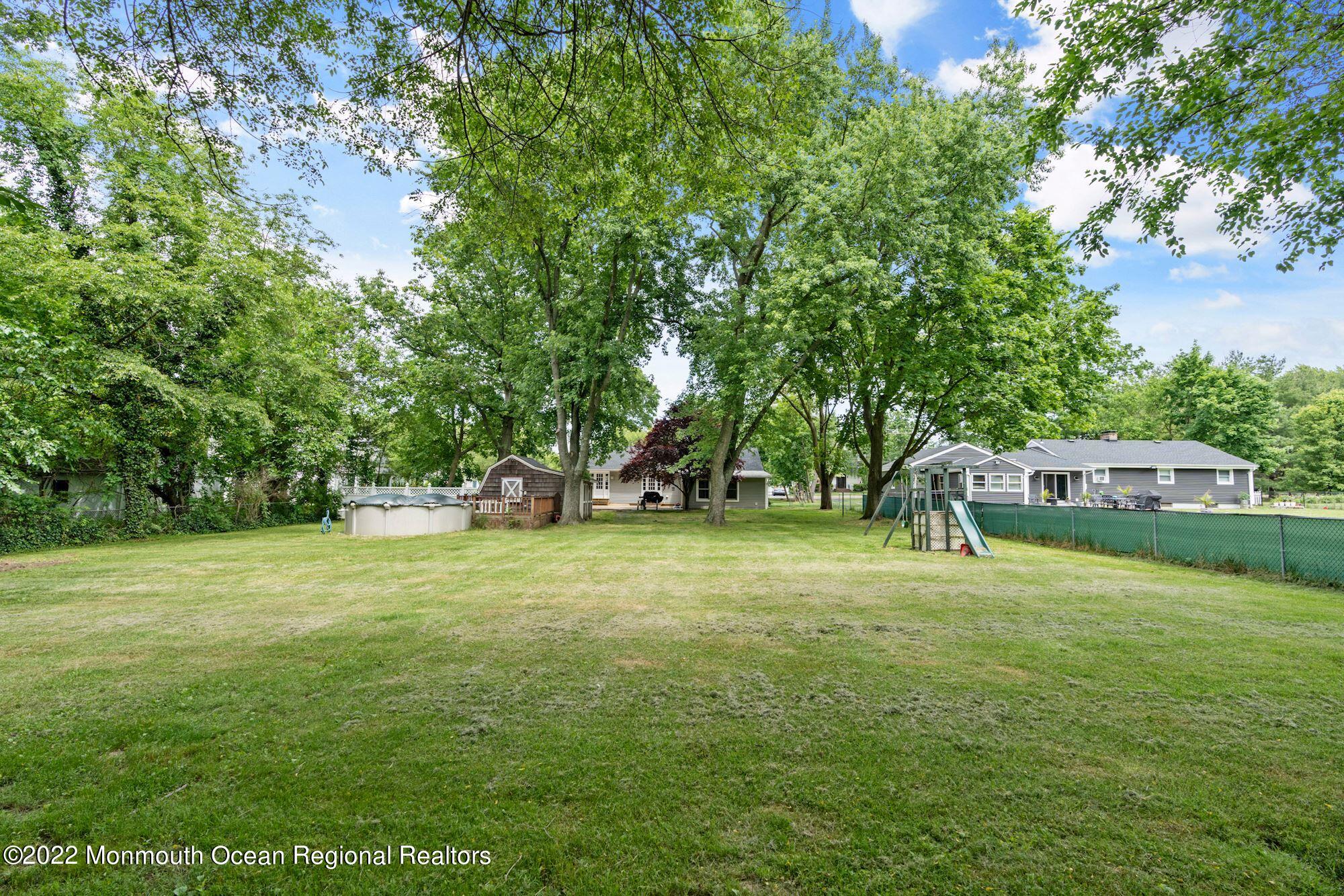 738 Holmdel Road Holmdel, NJ 07733 - Photo 9 of 36 a view of a trees in a yard