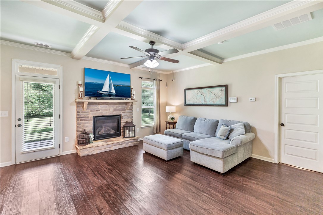 144 Buckland Drive Anderson, SC 29621 - Photo 42 of 48 Rich hardwood floors complement the elegant coffered ceilings in this inviting living space.