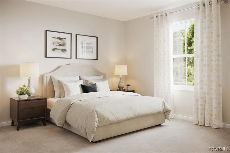 2113 Destination Drive, Unit A Sandston, VA 23150 - Photo 5 of 9 a bedroom with a bed and a window