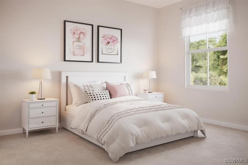 2113 Destination Drive, Unit A Sandston, VA 23150 - Photo 7 of 9 a bedroom with a bed and a night stand