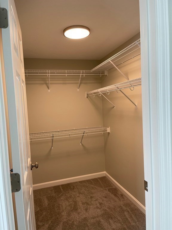 30 Markham Circle Ayer, MA 01432 - Photo 11 of 22 a view of a room with racks on the wall