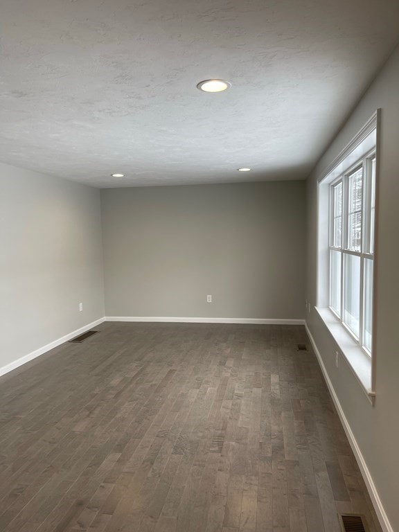 30 Markham Circle Ayer, MA 01432 - Photo 8 of 22 an empty room with a empty space and windows