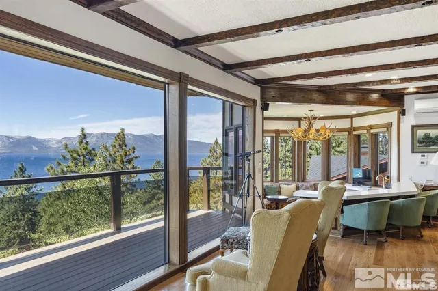 a spacious bedroom with large bed and a large window