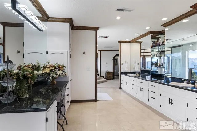 a bedroom with bed and a large window