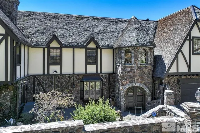 a dining room with furniture window and wooden floor