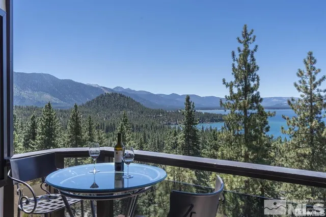 a bathroom with a double vanity sink mirror and shower