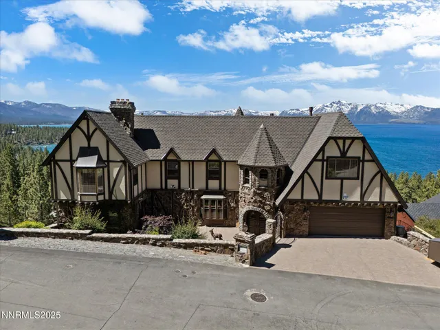 a aerial view of a house with a yard