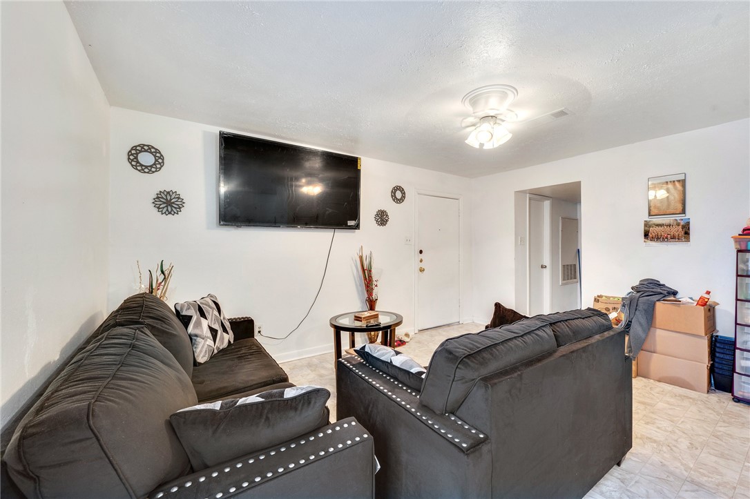 1526 Pine Ridge Drive College Station, TX 77840 - Photo 12 of 17 a living room with furniture and a flat screen tv
