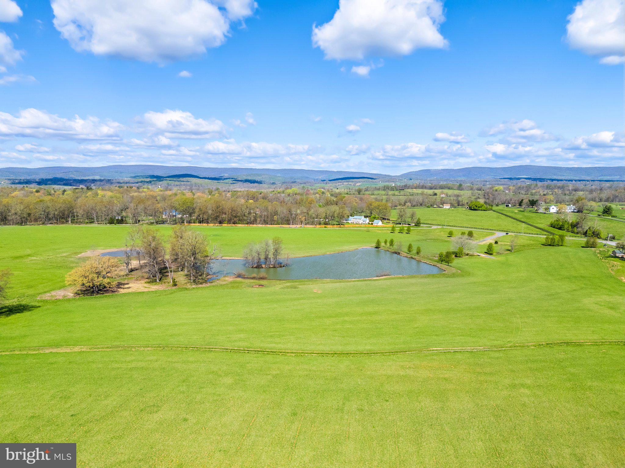 a view of an ocean and a yard