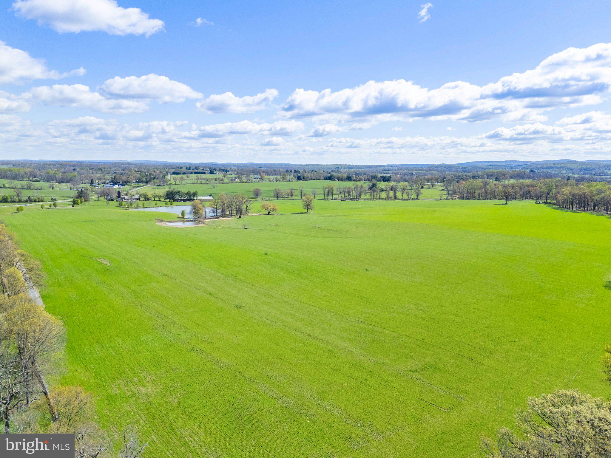 Atoka Road Marshall, VA 20115 - Photo 16 of 26 a view of a large building with a big yard
