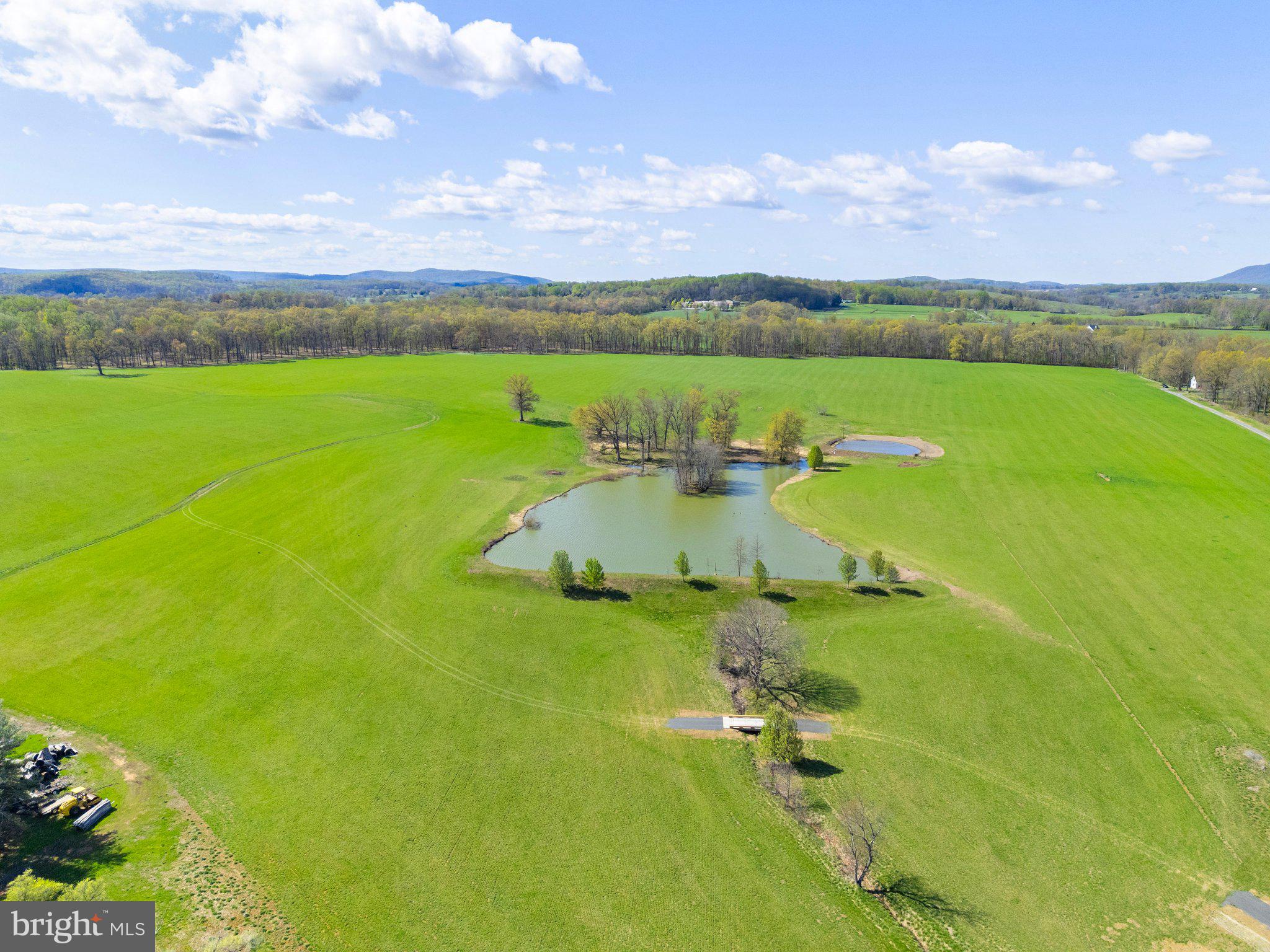 Atoka Road Marshall, VA 20115 - Photo 6 of 26 an aerial view of a houses with outdoor space swimming pool and mountains in the background