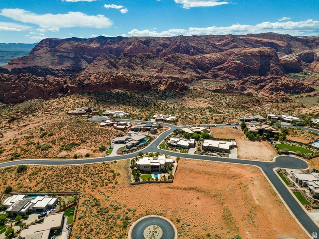 Basalt Cir Street, Unit 1027 St. George, UT 84770 - Photo 17 of 29 Aerial view of residential area featuring a mountain backdrop