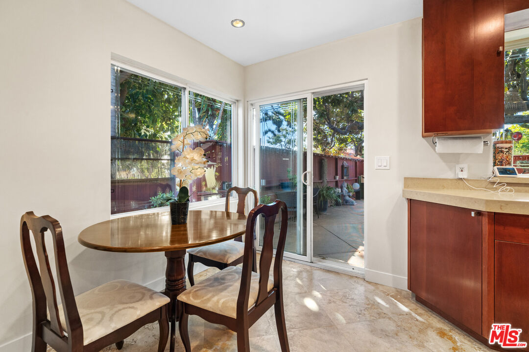 5008 Valley Ridge Avenue View Park, CA 90043 - Photo 12 of 28 a dining room with furniture and window