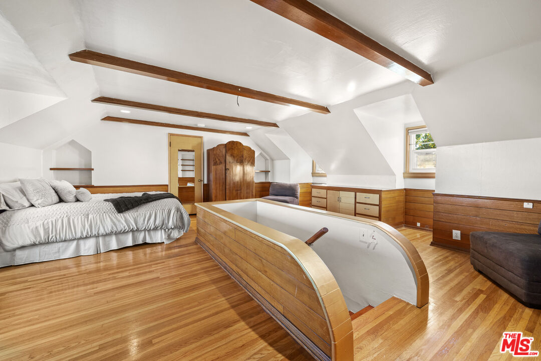 5008 Valley Ridge Avenue View Park, CA 90043 - Photo 20 of 28 a spacious bedroom with two beds and a couch