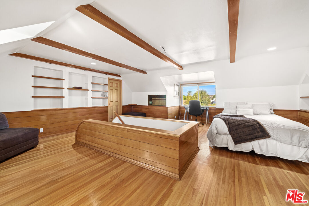 5008 Valley Ridge Avenue View Park, CA 90043 - Photo 21 of 28 a living room with furniture and a wooden floor