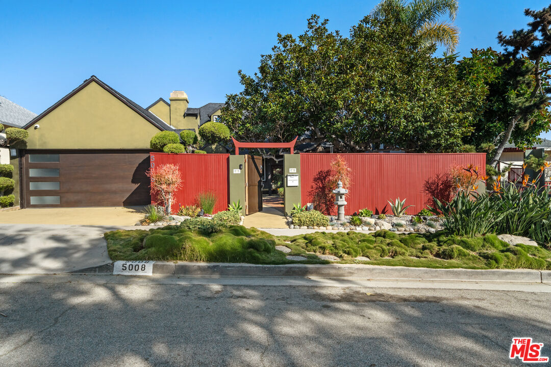 5008 Valley Ridge Avenue View Park, CA 90043 - Photo 3 of 28 front view of a house with a street