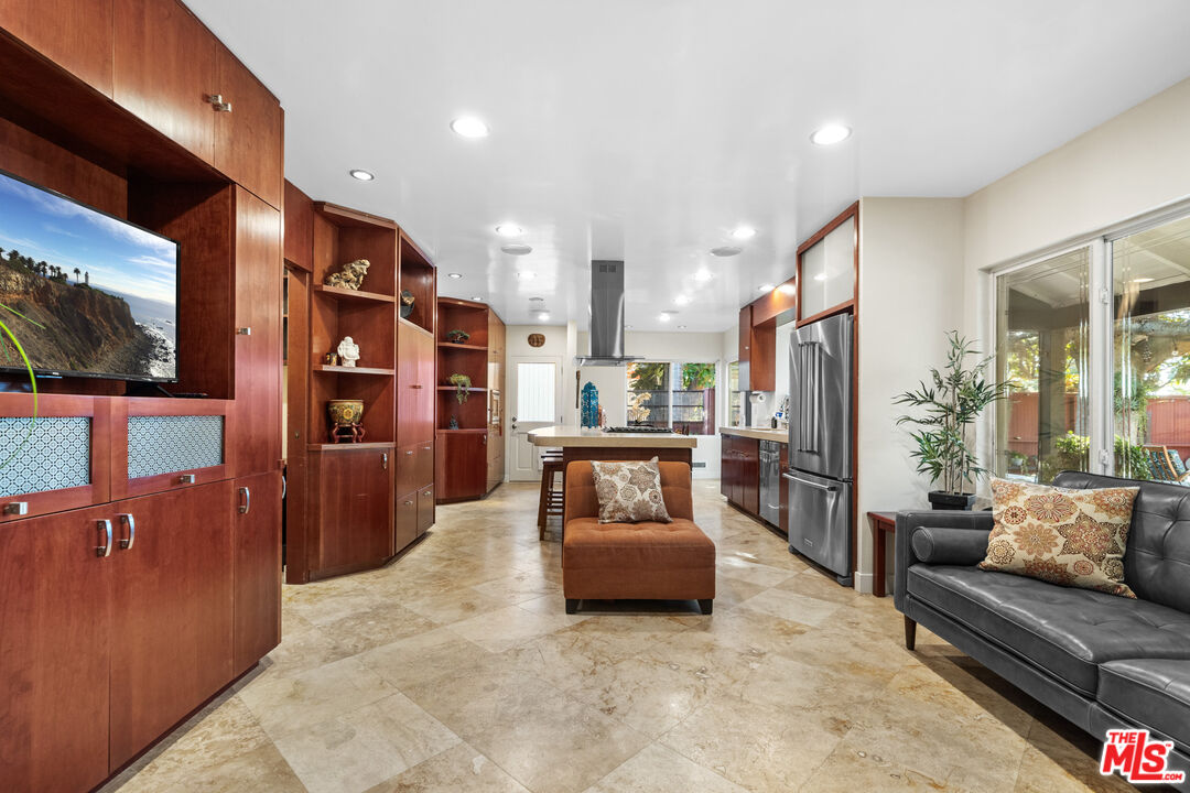 5008 Valley Ridge Avenue View Park, CA 90043 - Photo 9 of 28 a living room with furniture and a flat screen tv