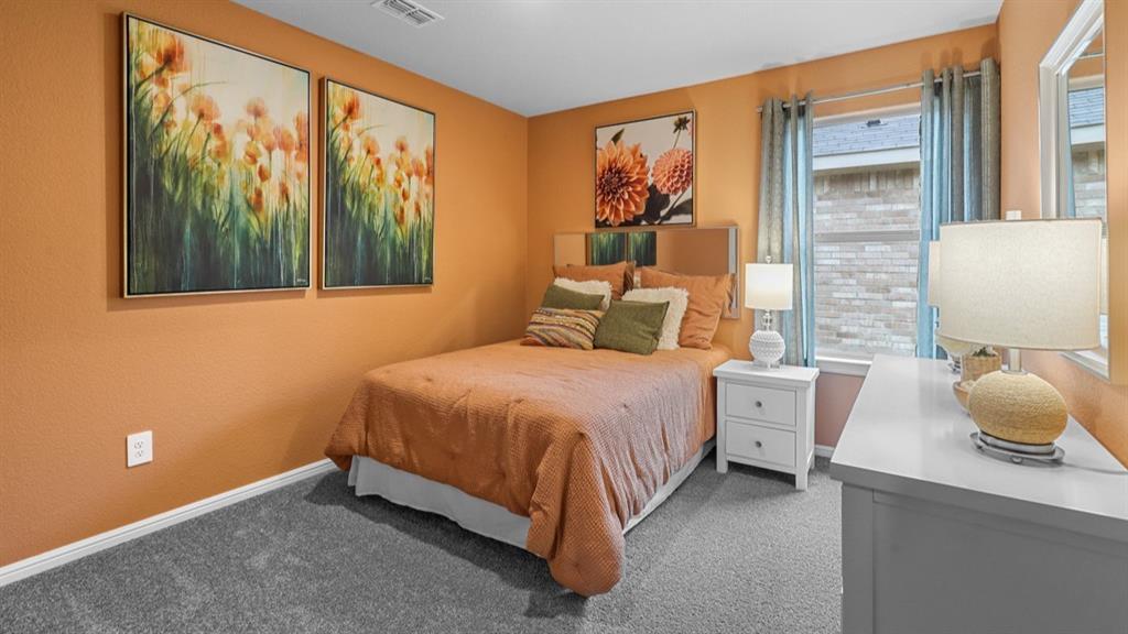 16417 Rangerville Drive Justin, TX 76247 - Photo 29 of 39 a bedroom with a bed and a window