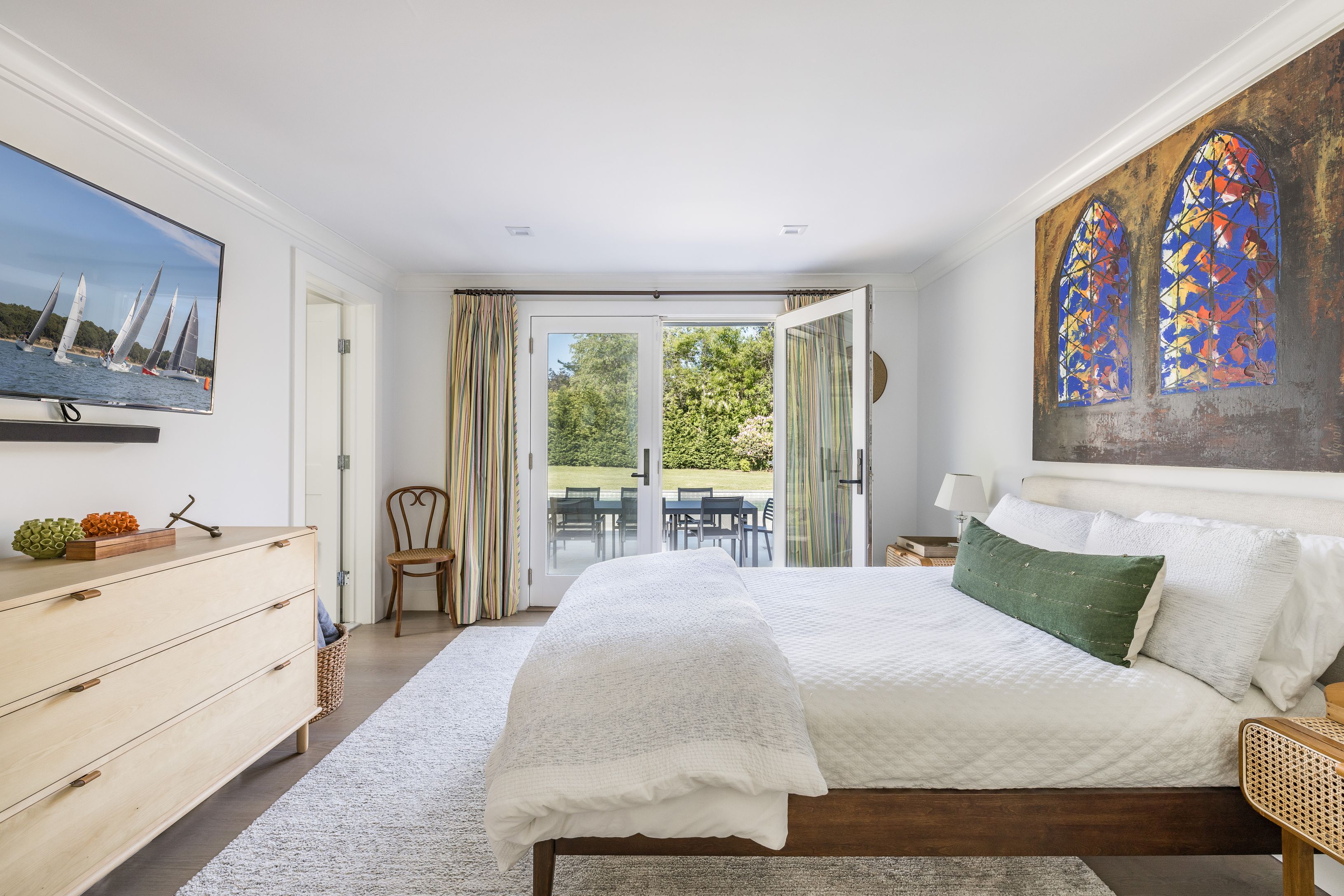 254 Water Mill Water Mill, NY 11976 - Photo 11 of 15 a bedroom with a bed and a painting on the wall