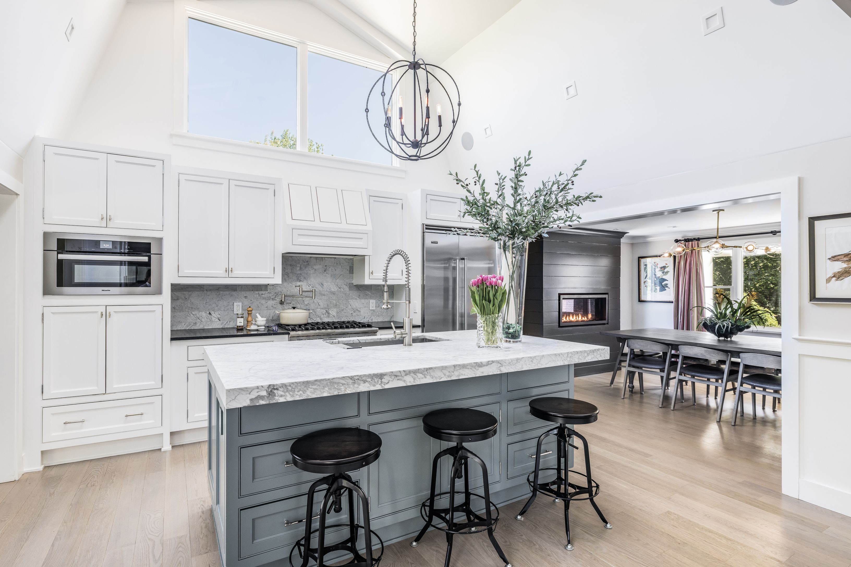 254 Water Mill Water Mill, NY 11976 - Photo 5 of 15 a kitchen with stainless steel appliances granite countertop a stove top oven a refrigerator a dining table and chairs with wooden floor