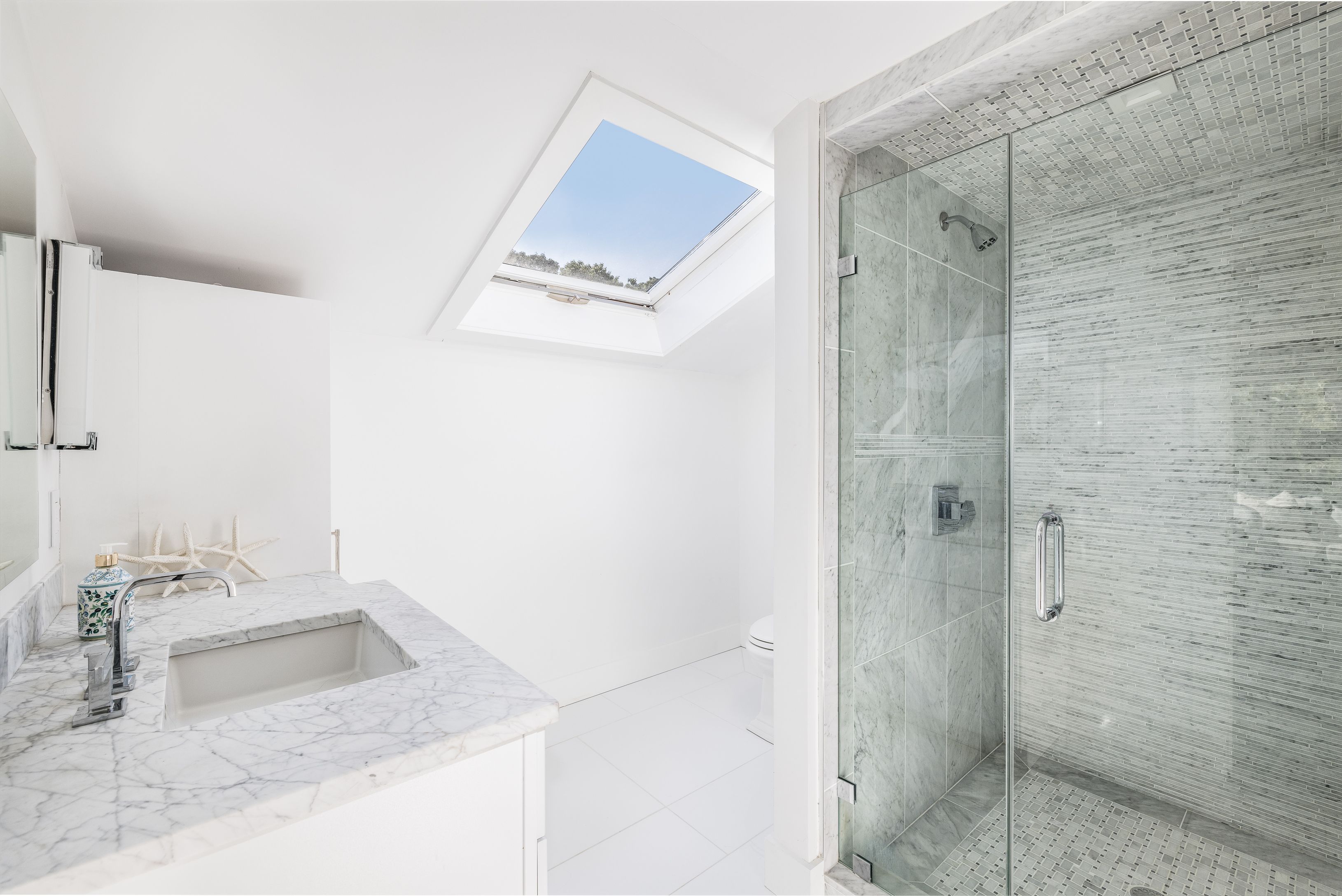 254 Water Mill Water Mill, NY 11976 - Photo 10 of 15 a bathroom with a granite countertop sink a shower and a mirror