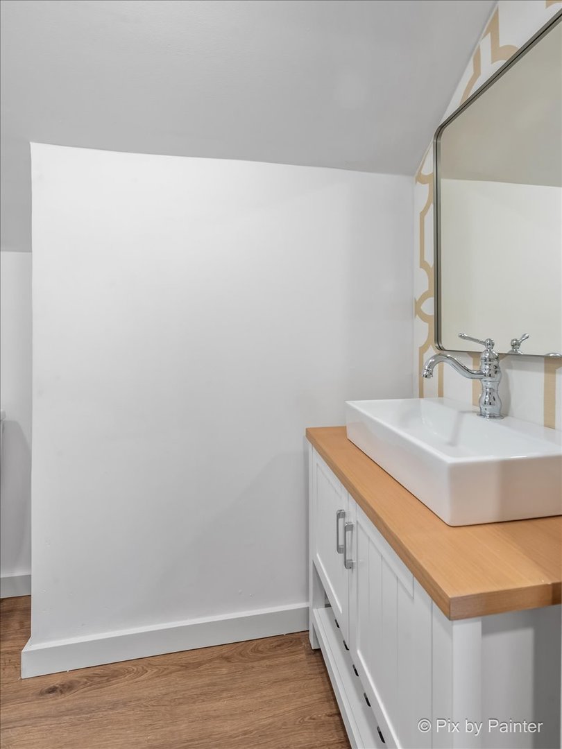 3019 Lincoln Road McHenry, IL 60051 - Photo 19 of 28 a bathroom with a sink and a mirror