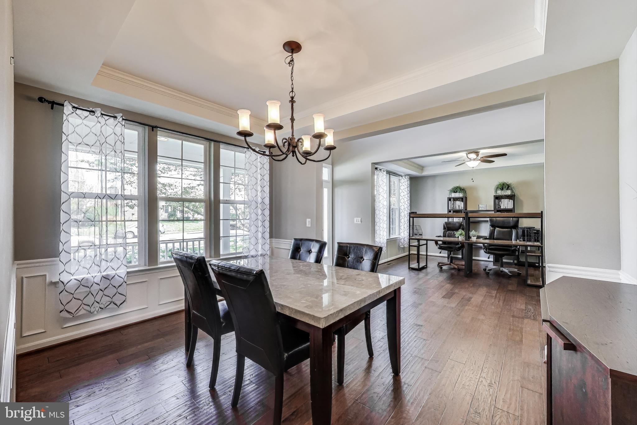 5701 Wink Way Woodbridge, VA 22193 - Photo 11 of 45 a view of a dining room with furniture window and wooden floor