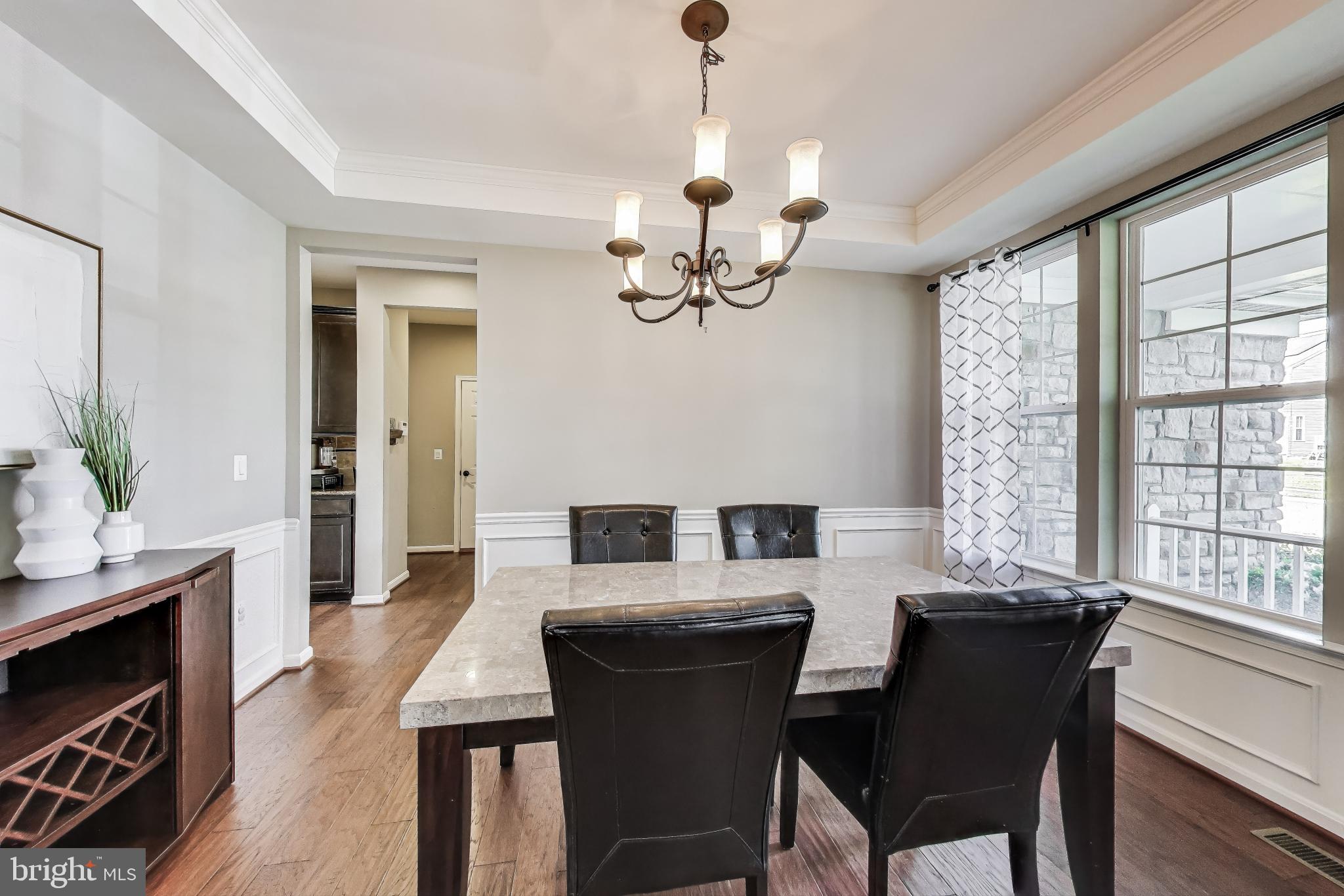 5701 Wink Way Woodbridge, VA 22193 - Photo 12 of 45 a view of a dining room with furniture window and wooden floor