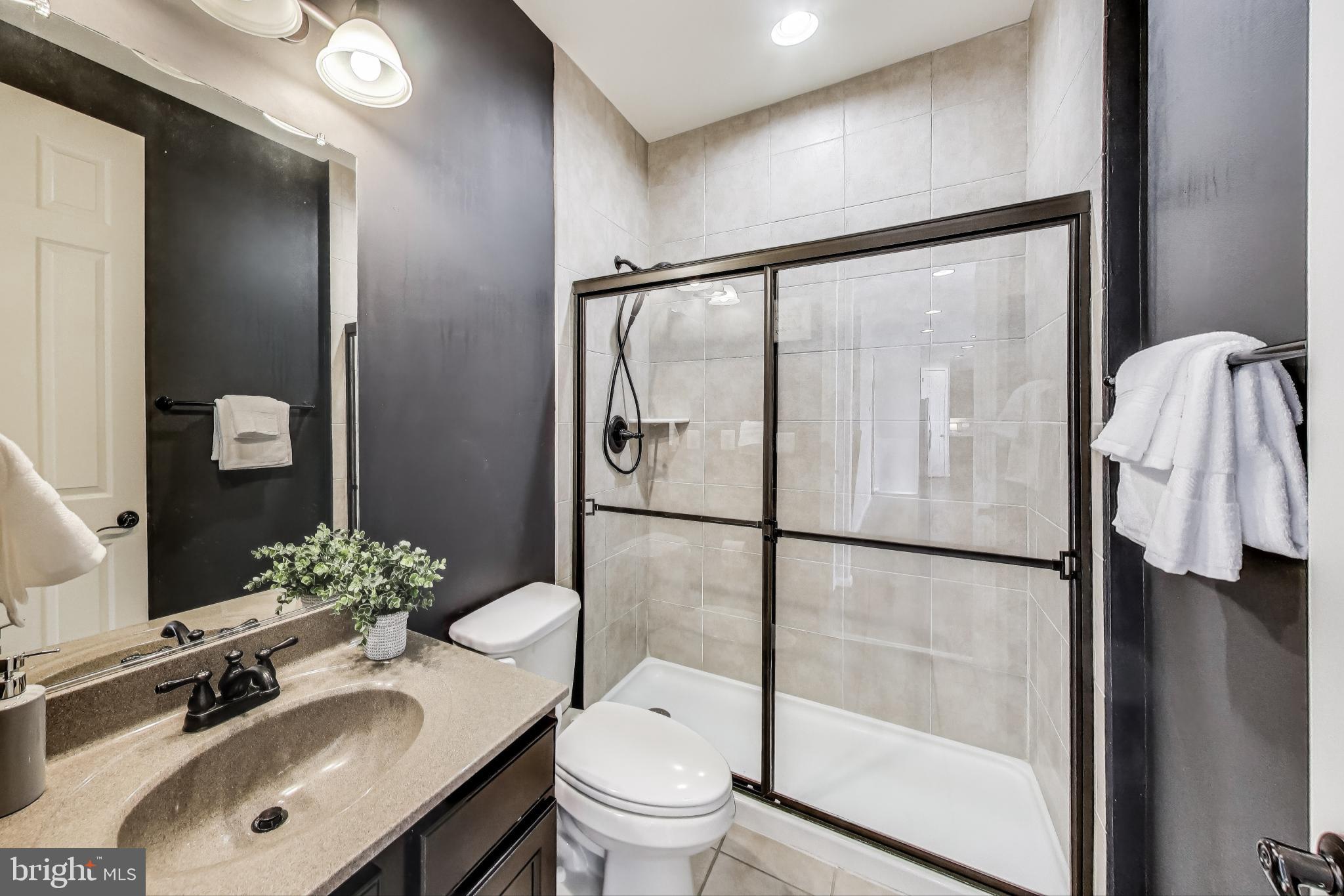 5701 Wink Way Woodbridge, VA 22193 - Photo 16 of 45 a bathroom with a sink toilet and shower