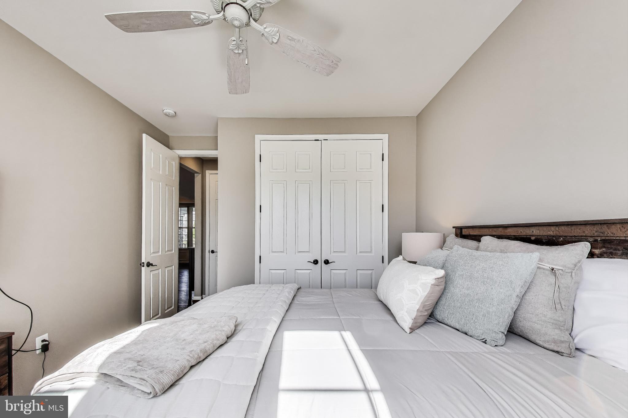 5701 Wink Way Woodbridge, VA 22193 - Photo 18 of 45 a bedroom with a large bed and chandelier