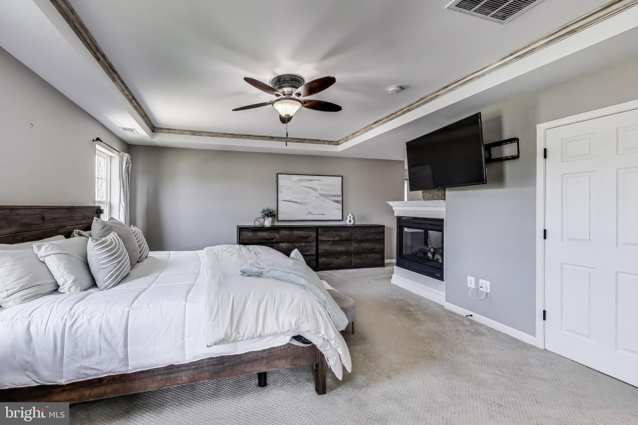 5701 Wink Way Woodbridge, VA 22193 - Photo 20 of 45 a bedroom with a bed and a flat screen tv