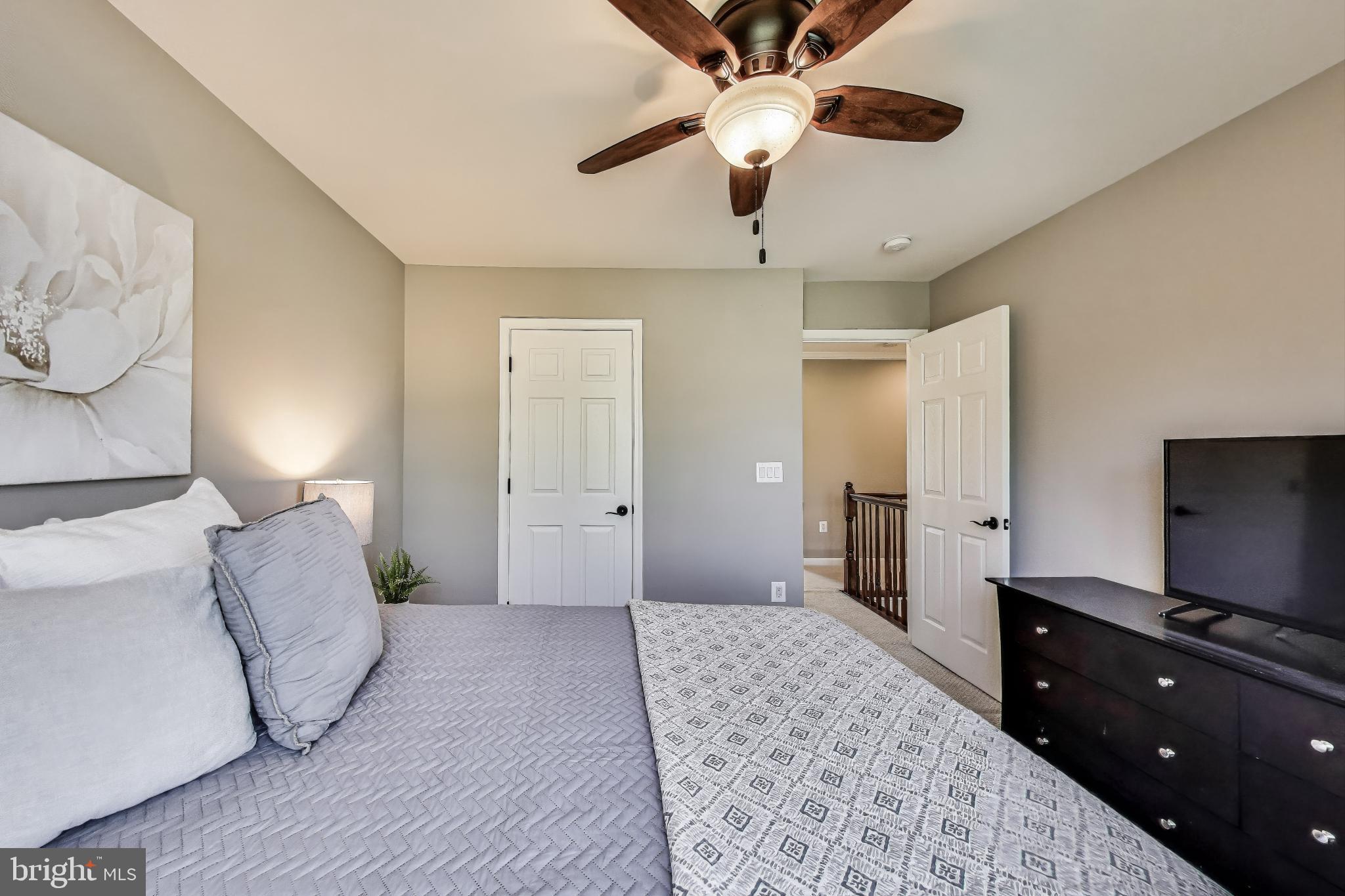 5701 Wink Way Woodbridge, VA 22193 - Photo 26 of 45 a bedroom with a bed and a flat screen tv