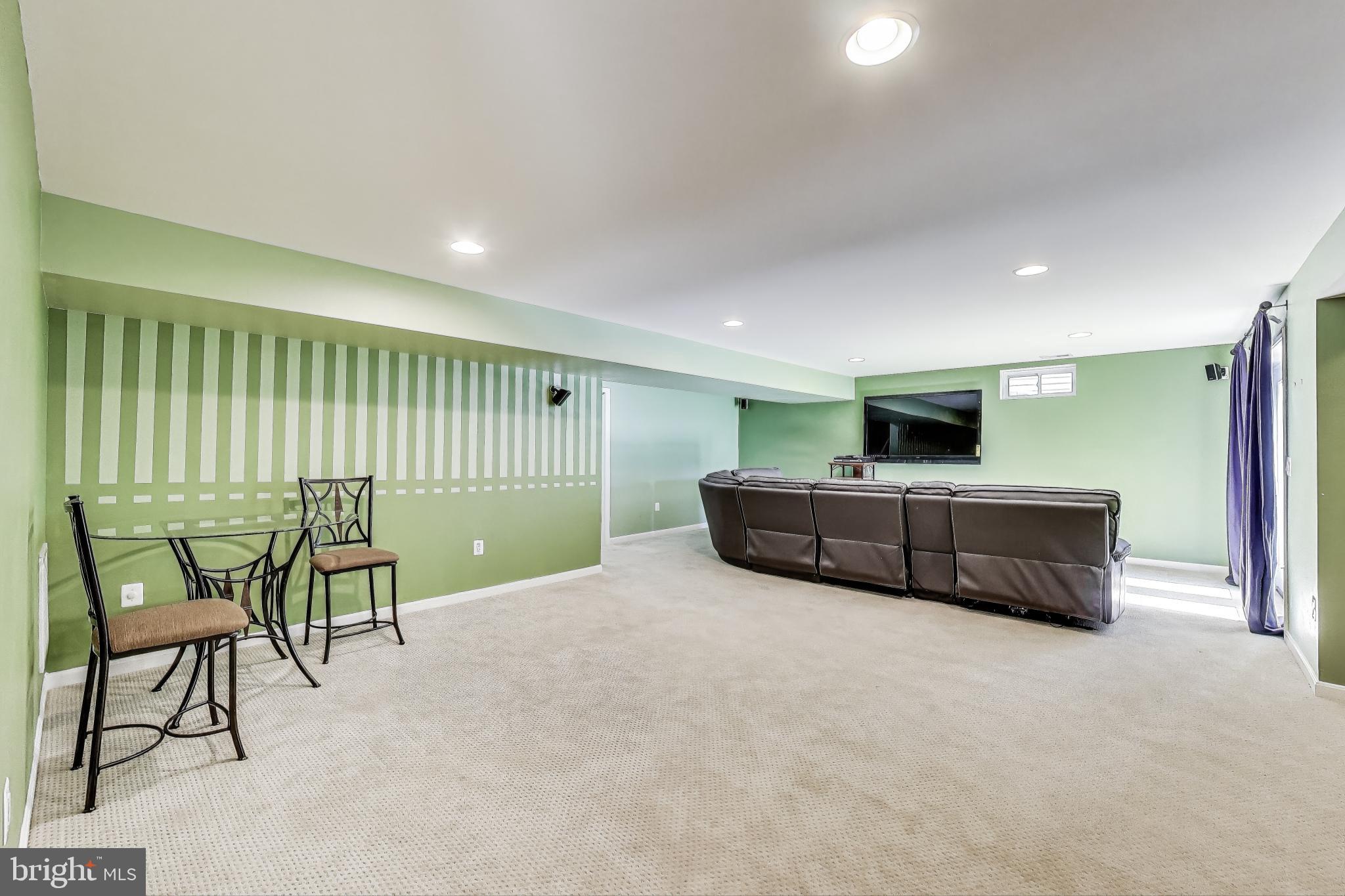 5701 Wink Way Woodbridge, VA 22193 - Photo 32 of 45 a living room with furniture and a wooden floor