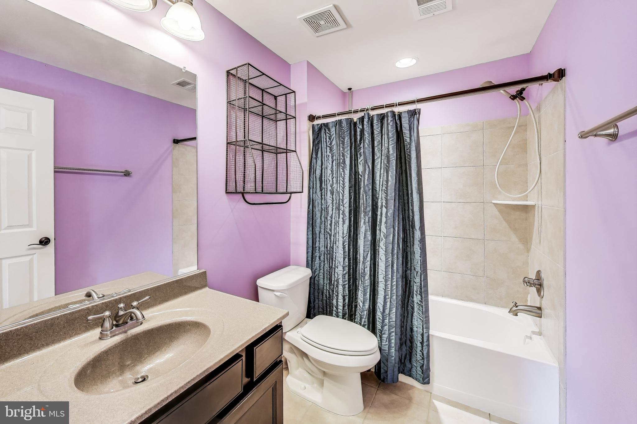 5701 Wink Way Woodbridge, VA 22193 - Photo 36 of 45 a bathroom with a sink toilet and shower
