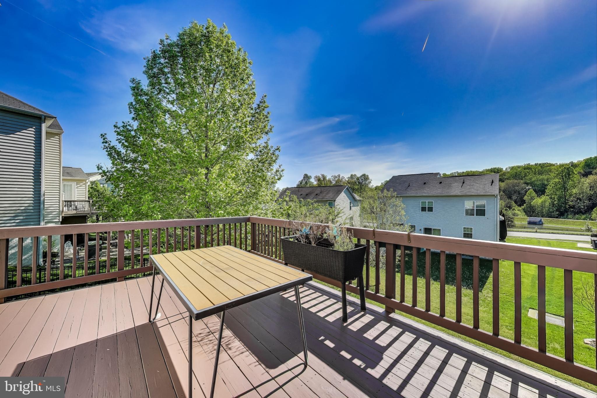 5701 Wink Way Woodbridge, VA 22193 - Photo 45 of 45 a view of a balcony with wooden floor and outdoor seating
