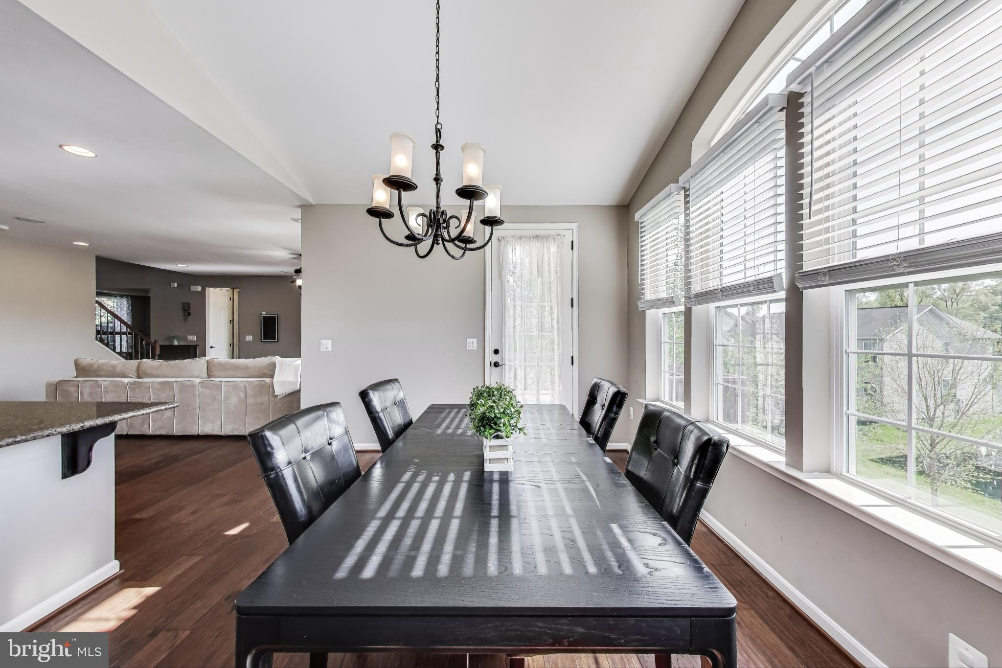 5701 Wink Way Woodbridge, VA 22193 - Photo 7 of 45 a view of a dining room with furniture window and wooden floor