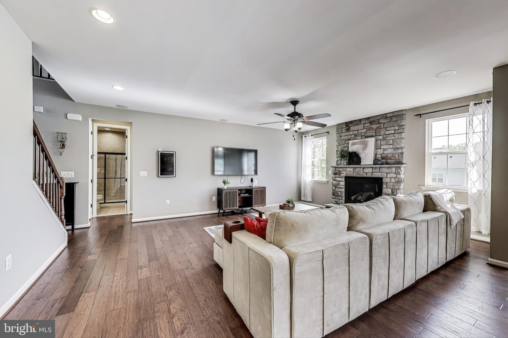 5701 Wink Way Woodbridge, VA 22193 - Photo 9 of 45 a living room with furniture and a fireplace