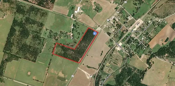 an aerial view of a residential houses with outdoor space