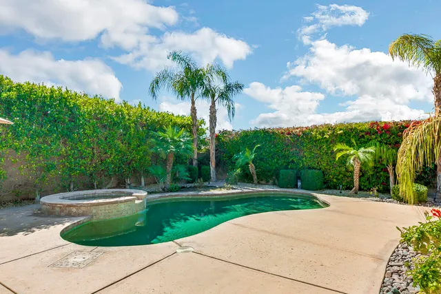 a view of a fountain in front of a house