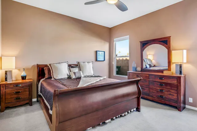 a bedroom with a bed and a large dresser