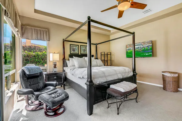 a bedroom with furniture and a window