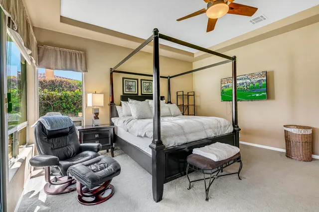 a bedroom with furniture and a window